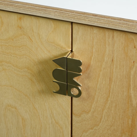 Symbols handle collection in polished brass