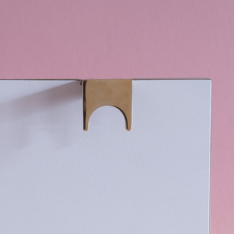 Symbols handle collection in polished brass