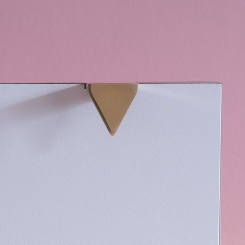 Symbols handle collection in polished brass