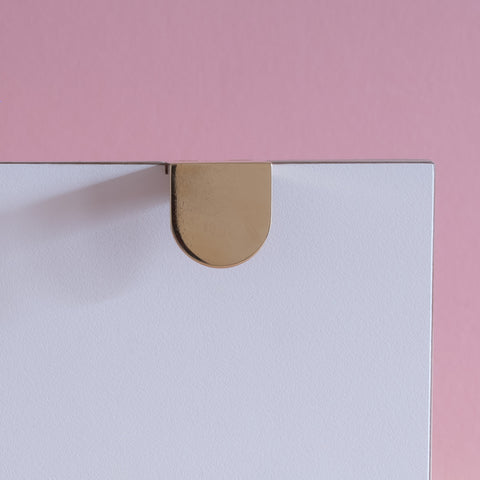 Symbols handle collection in polished brass