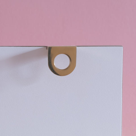 Symbols handle collection in polished brass
