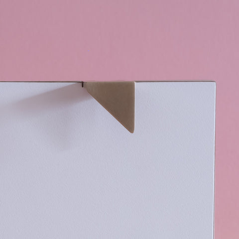 Symbols handle collection in brushed satin brass