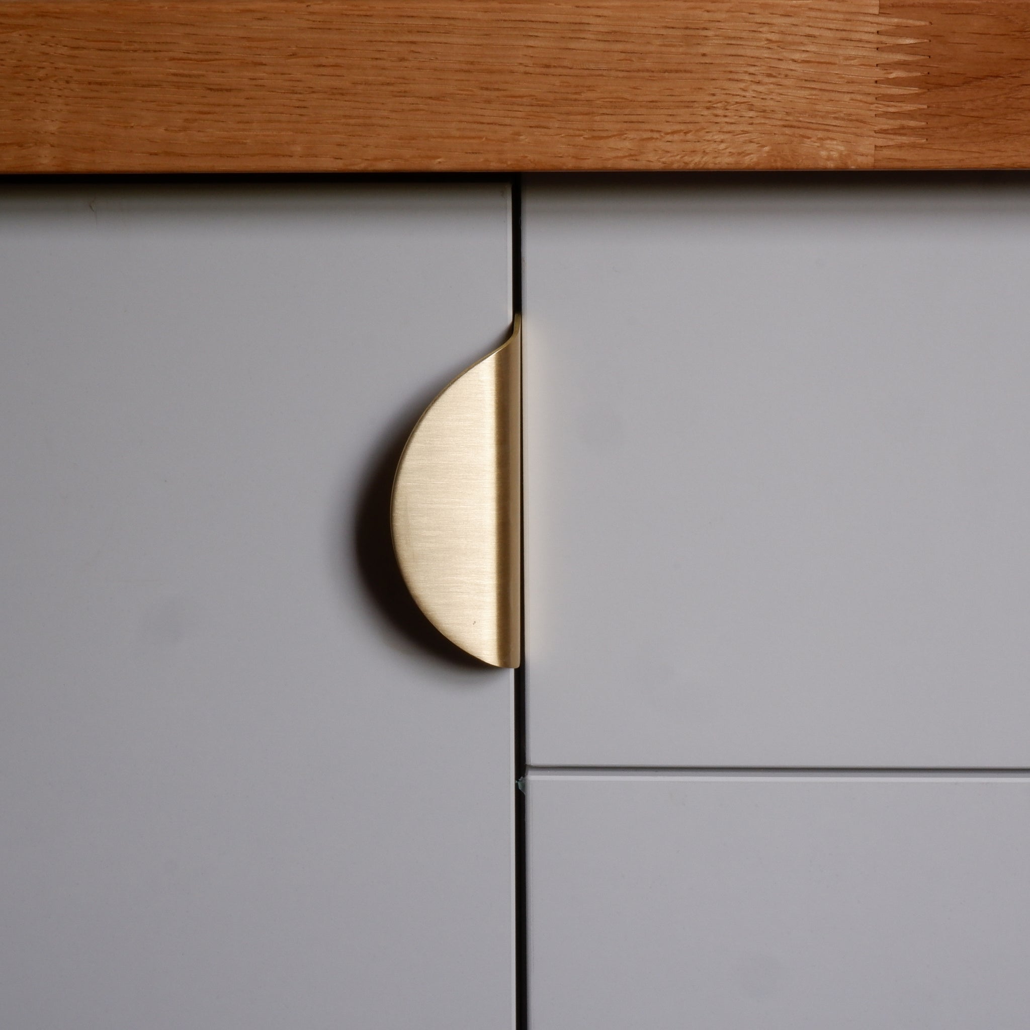 semi-circular edge pull kitchen handle in brass by Swarf hardware